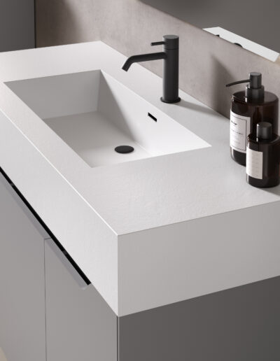 Particolare del Lavabo in Solid Surface. Composizione SLIM2 con base portalavabo SLIM2 da 120cm in Grigio Chiaro e frontale a contrasto in Marmo Bianco Carrara con parete attrezzata a colore.